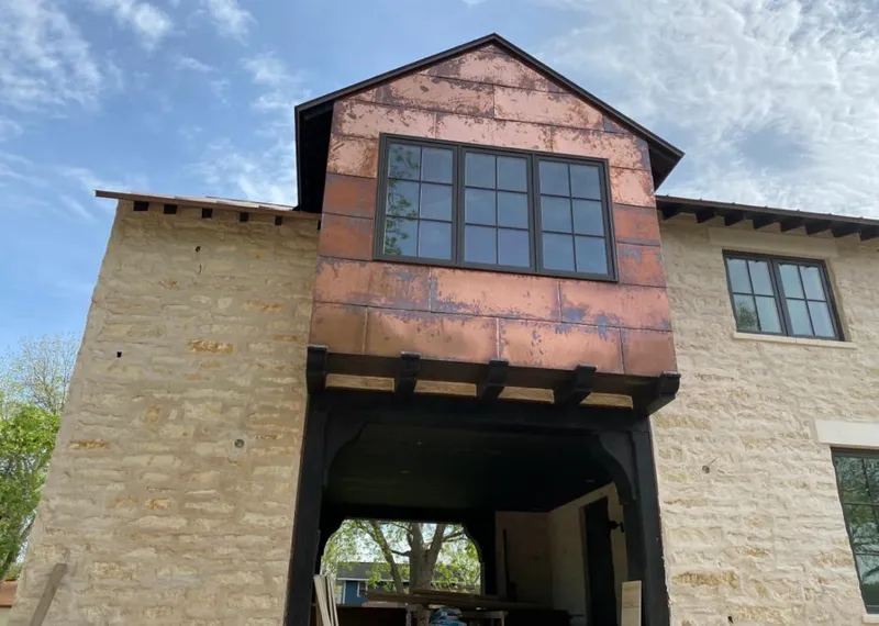 Copper metal panel facade on a stone building for Metal Roof Coating in Hilo