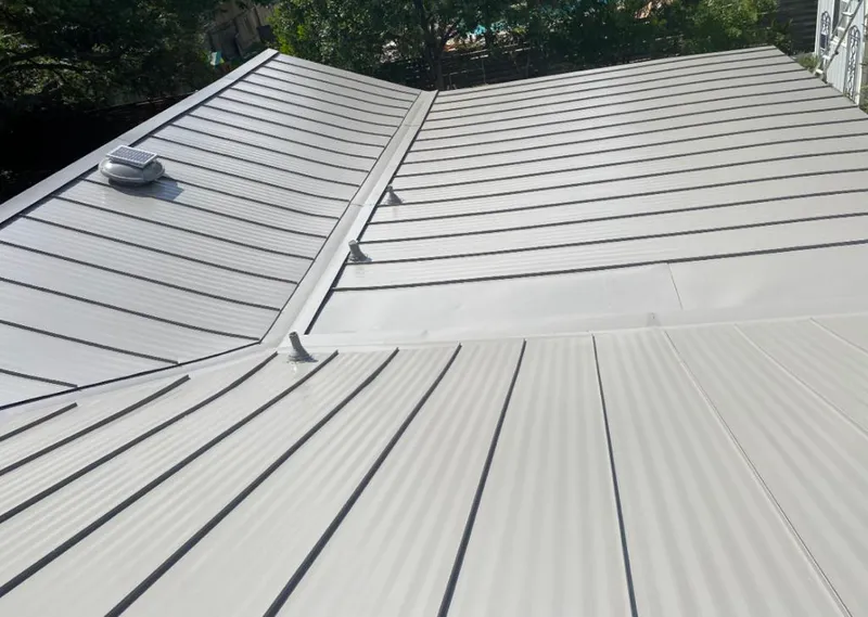 Solar attic fan installed on a metal roof for Roof Ventilation in Hilo